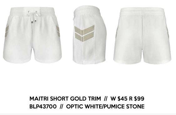 Three pairs of white shorts with gold trim on a white background