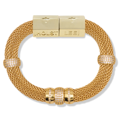 A gold-toned mesh bracelet with a rectangular clasp engraved with 'HOLST LEEI', accented by three bezel-set round crystal clusters on the lower arc and two smaller crystal accents on the opposite side.