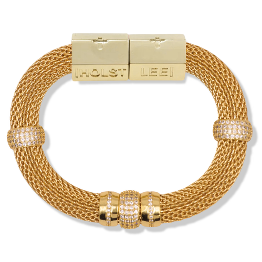A gold-toned mesh bracelet with a rectangular clasp engraved with 'HOLST LEEI', accented by three bezel-set round crystal clusters on the lower arc and two smaller crystal accents on the opposite side.