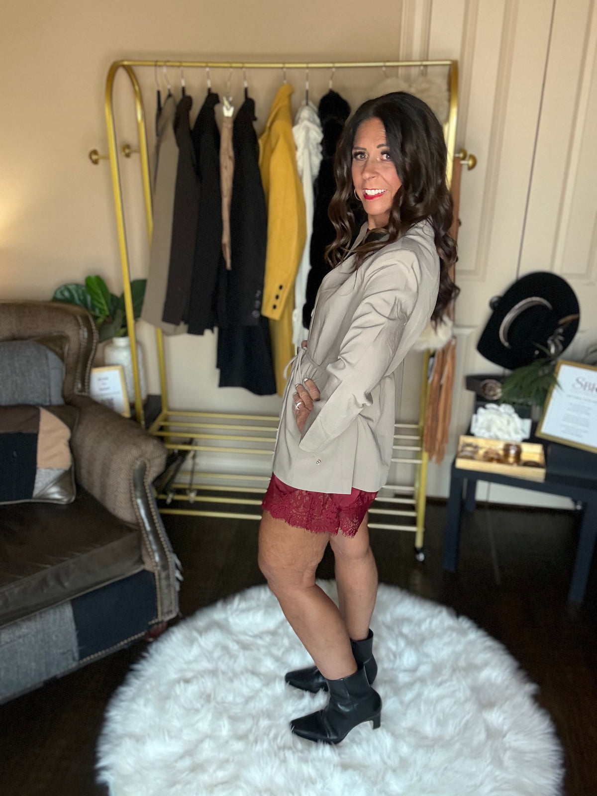 Side view of the taupe Perfect Layer Lightweight Tie Blazer showing the waist tie, styled with burgundy lace-trim shorts.