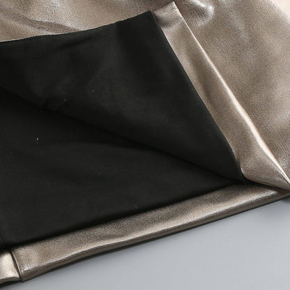 Close-up of black and metallic silver fabric on a light gray background