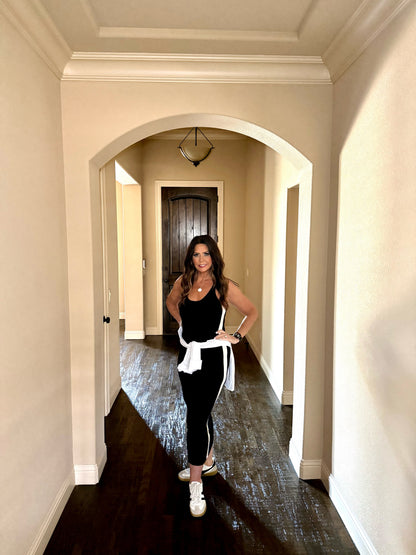 Woman walking down a hallway in a home