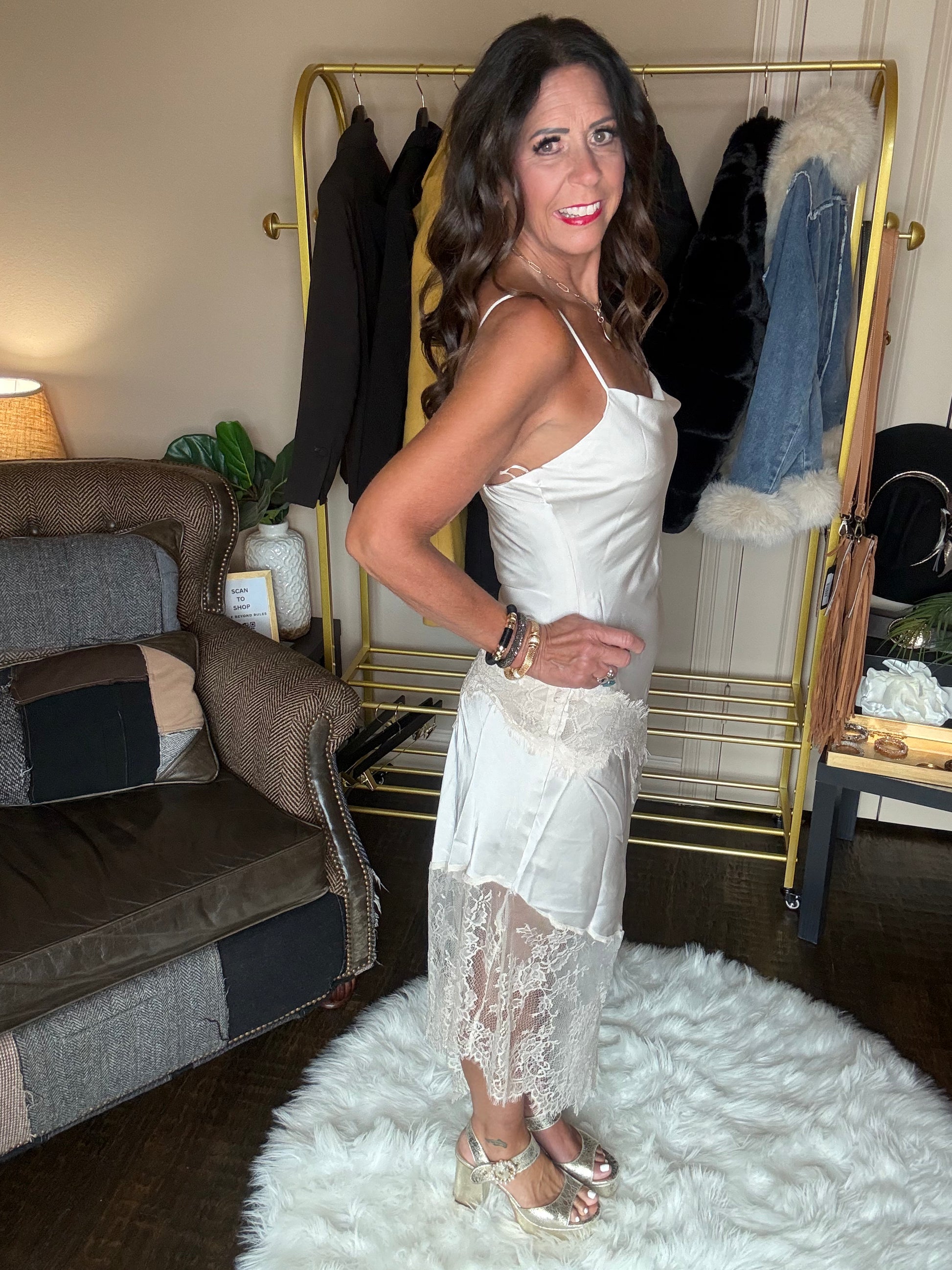 Three-quarter view of the pearl satin lace trim maxi dress with floral lace panels and metallic heels.