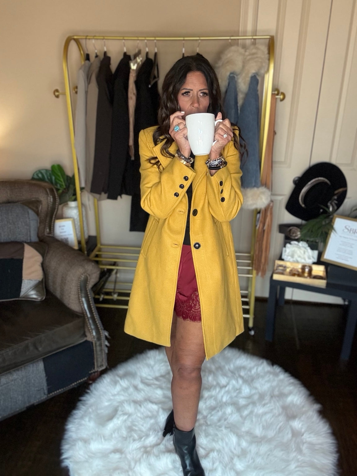 Front view of the yellow Autumn Stroll Coat styled with burgundy lace-trim shorts and black ankle boots.