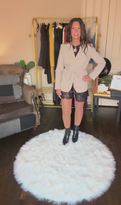 Video of the taupe Perfect Layer Lightweight Tie Blazer styled with black lace-trim shorts and black ankle boots.